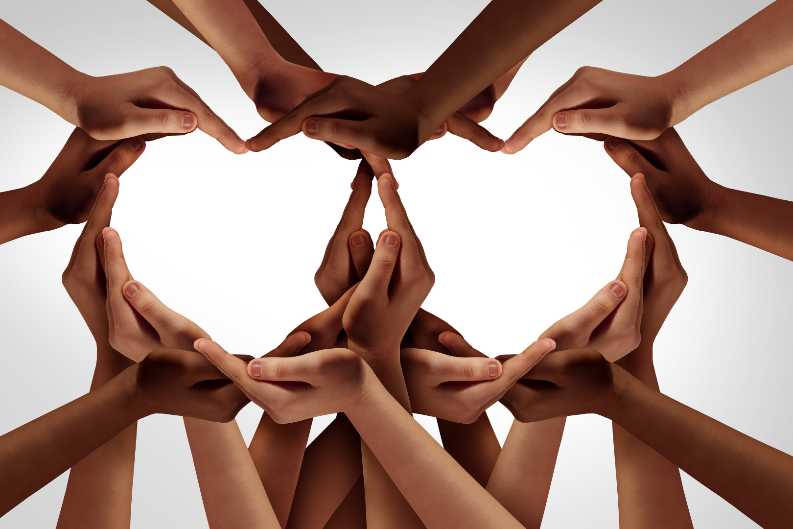 many hands of varying skin color and size forming two hearts