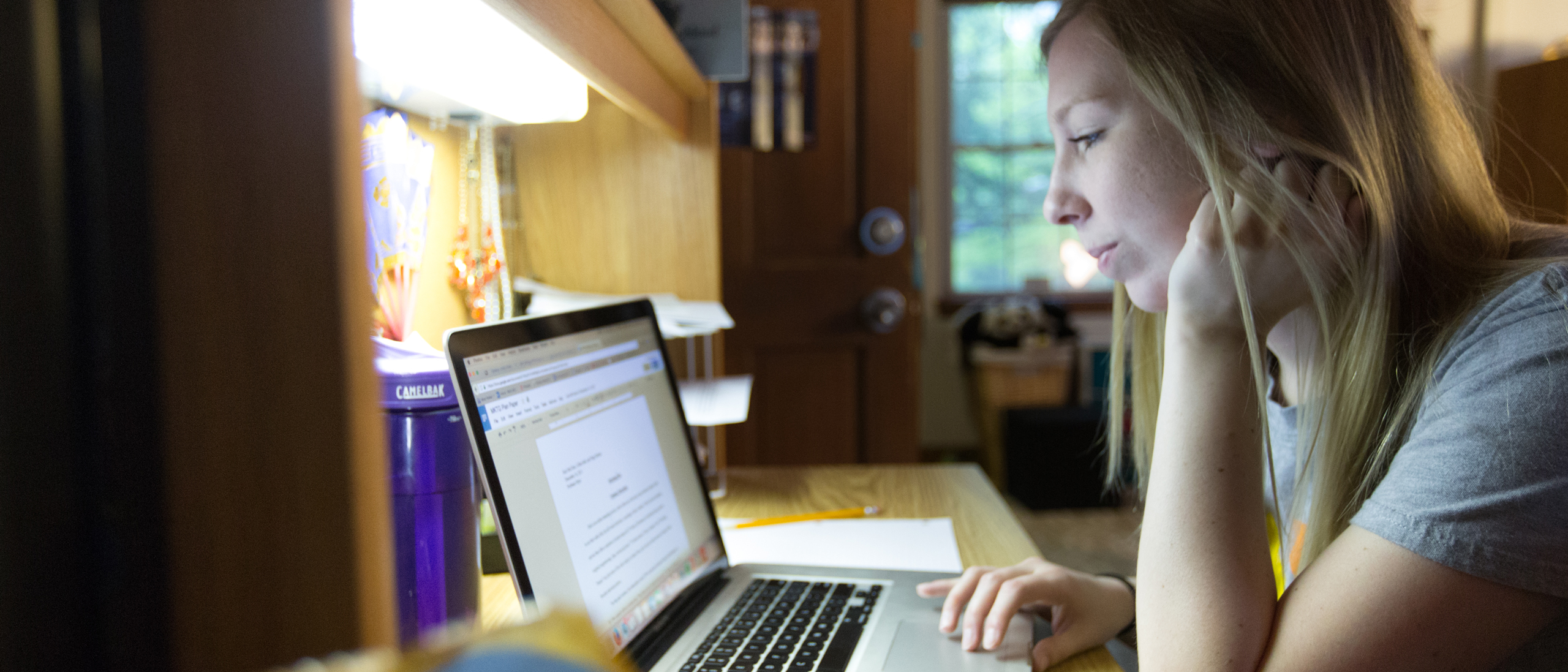 student studying on a laptop