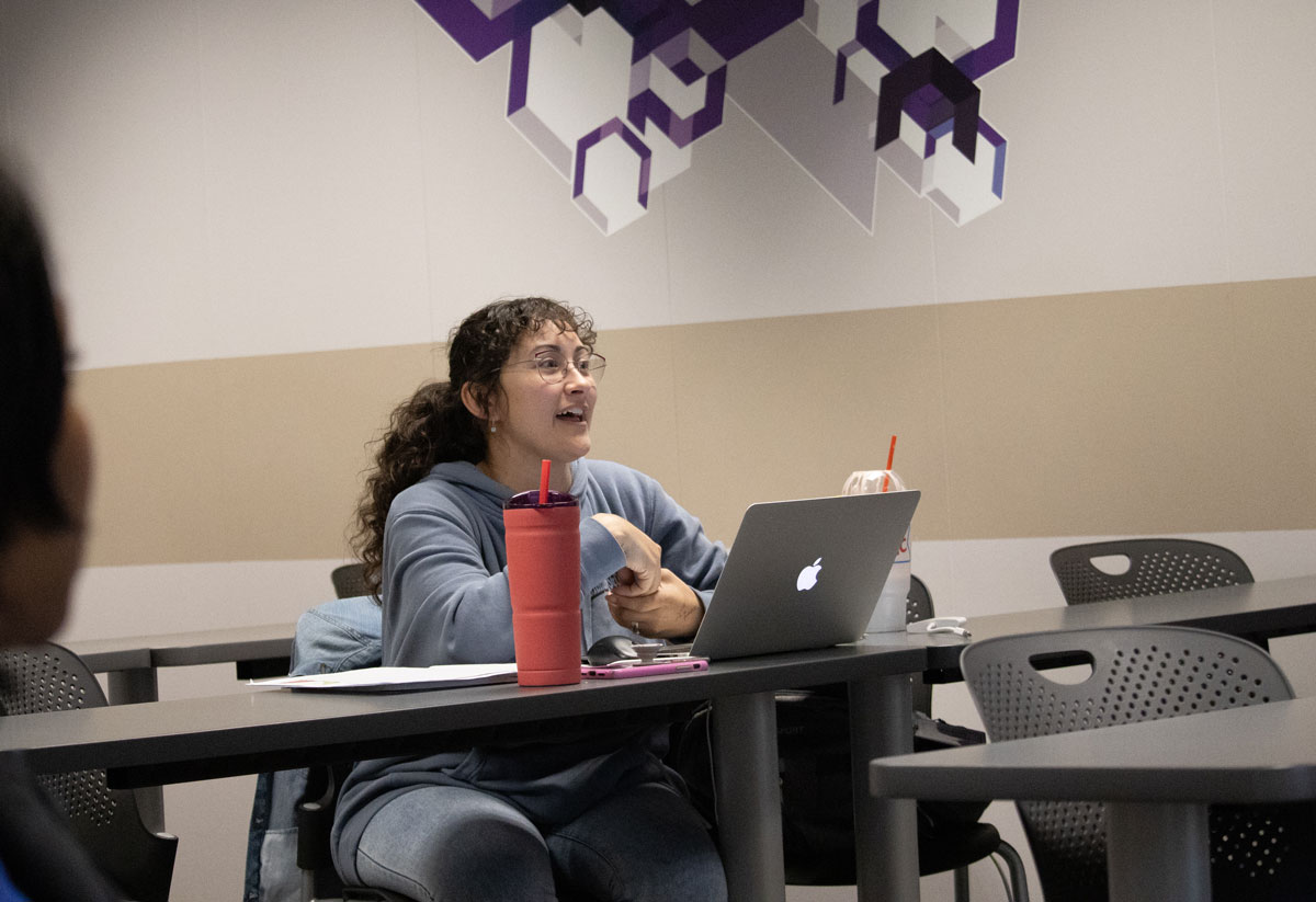 A student in the Salina MSW program asks a question during class